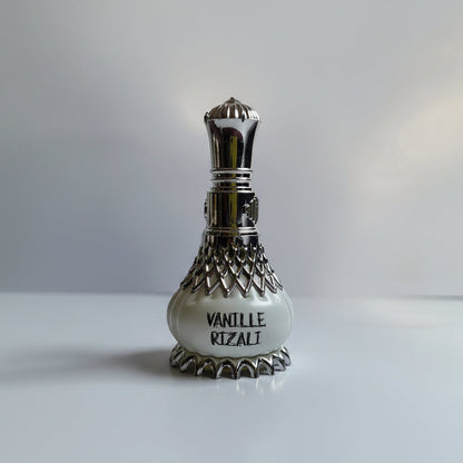 Perfume bottle with silver cap and decorative design on a white background