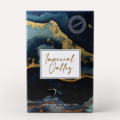 Perfume oil roll on packaging with 'Imperial Valley' branding on a blue and gold marbled background.