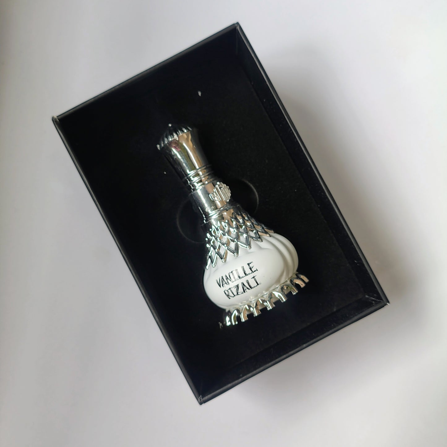Vanille Rizali Perfume and It's Box on a white background.