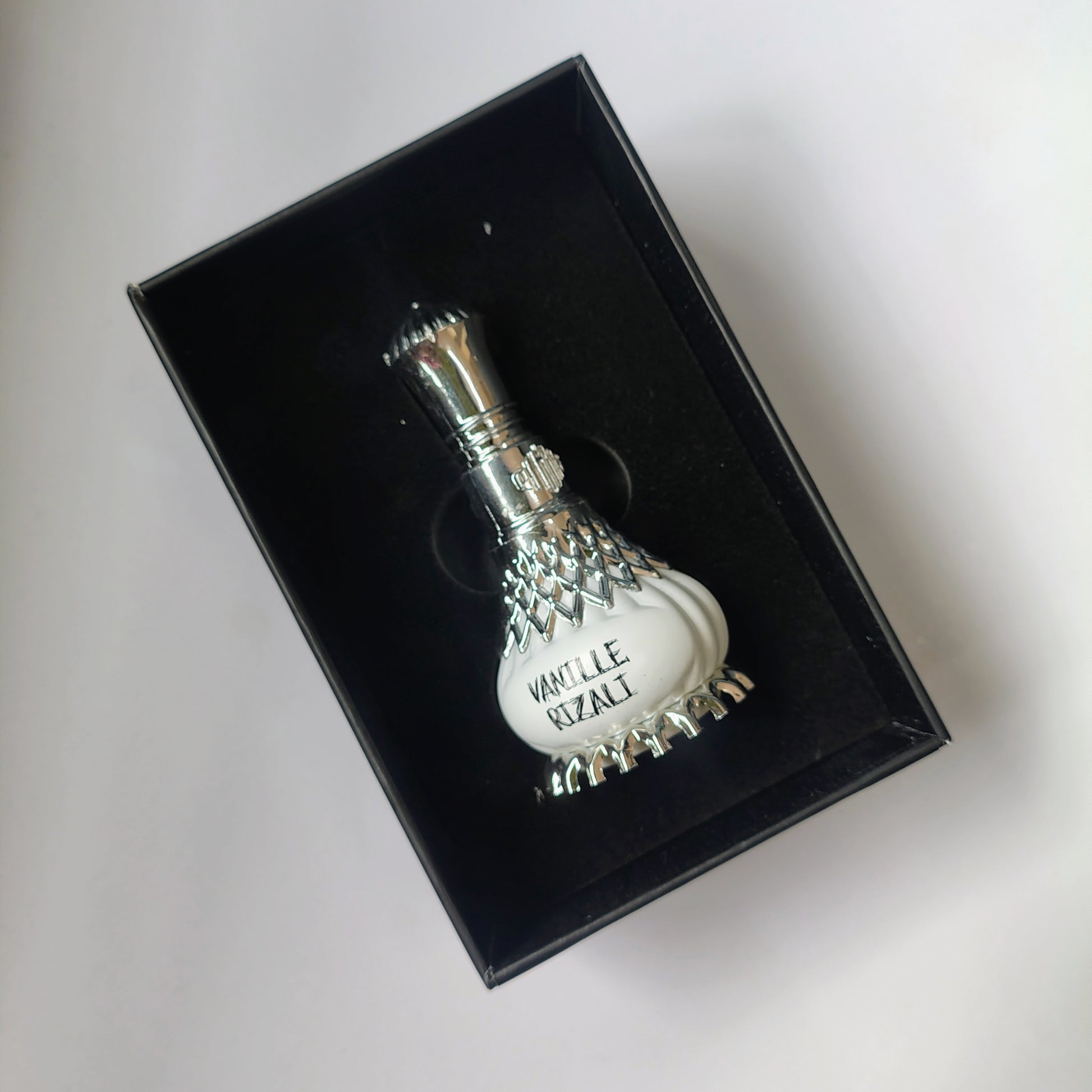Vanille Rizali Perfume and It's Box on a white background.